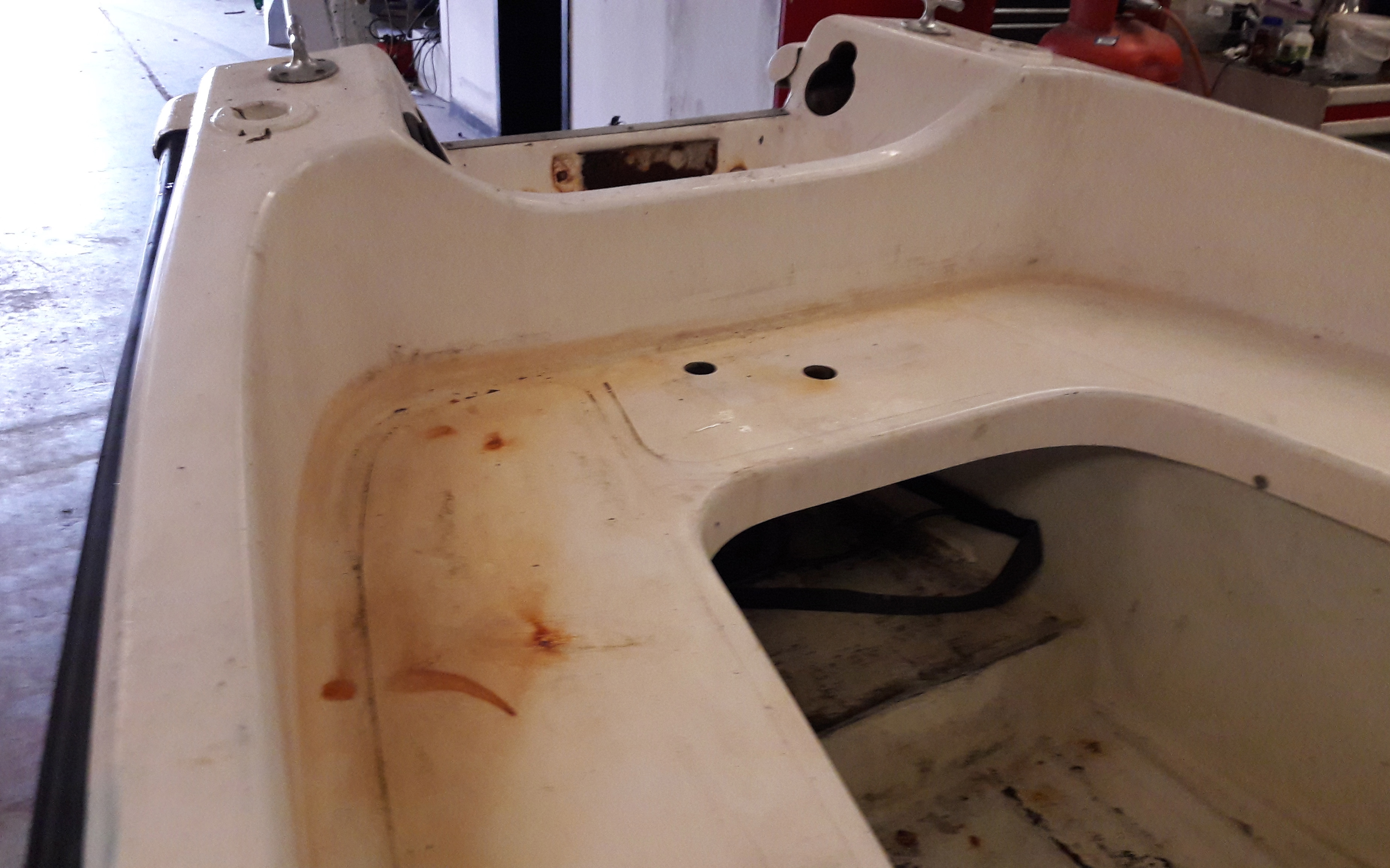 Cleaning the top deck of an Arran 16 Boat using acid